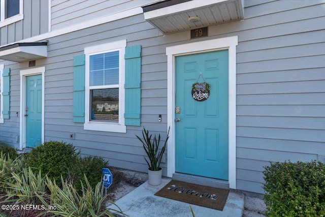 property entrance with board and batten siding