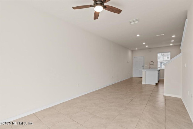 unfurnished living room featuring baseboards, a ceiling fan, visible vents, and recessed lighting