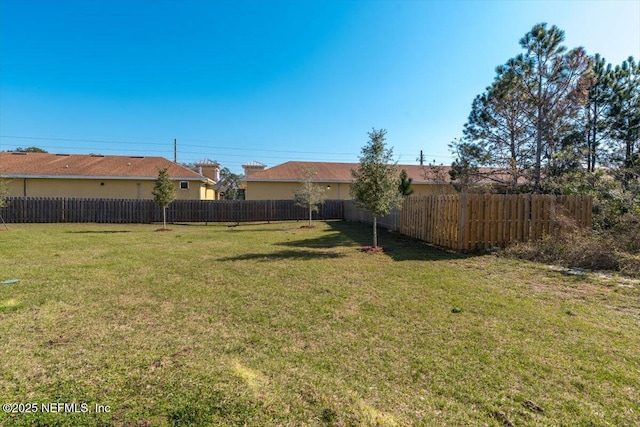 view of yard with fence