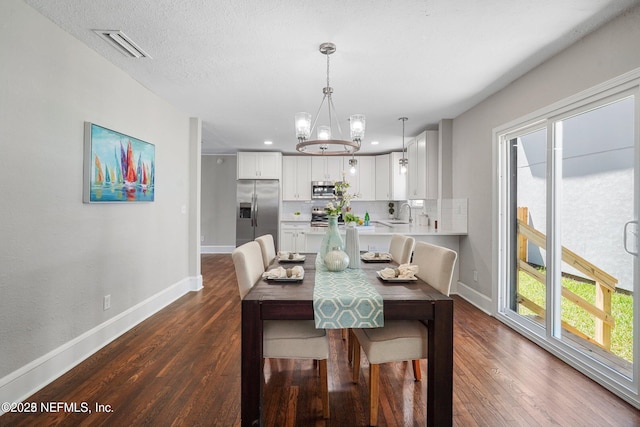 dining area featuring plenty of natural light, dark wood finished floors, and baseboards