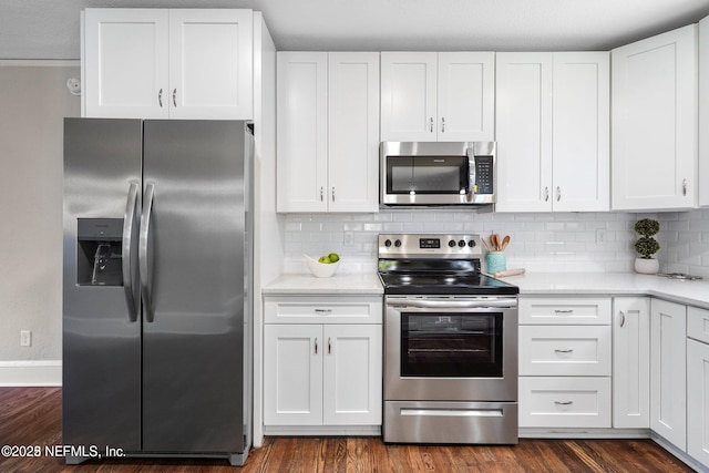 kitchen featuring appliances with stainless steel finishes and white cabinetry