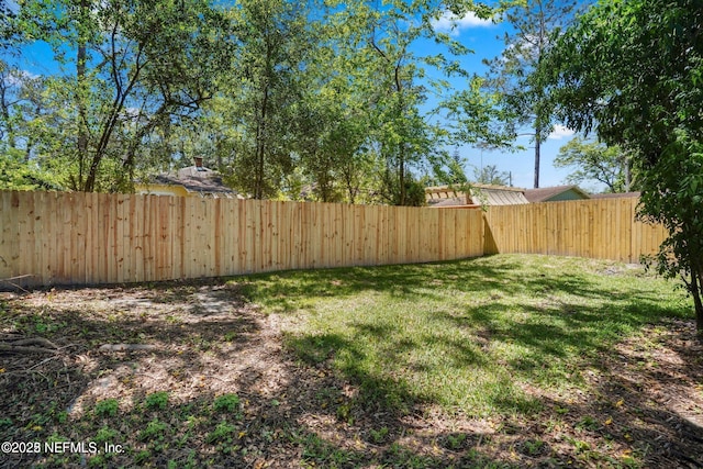 view of yard featuring a fenced backyard