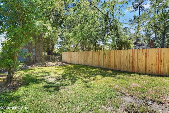 view of yard with fence