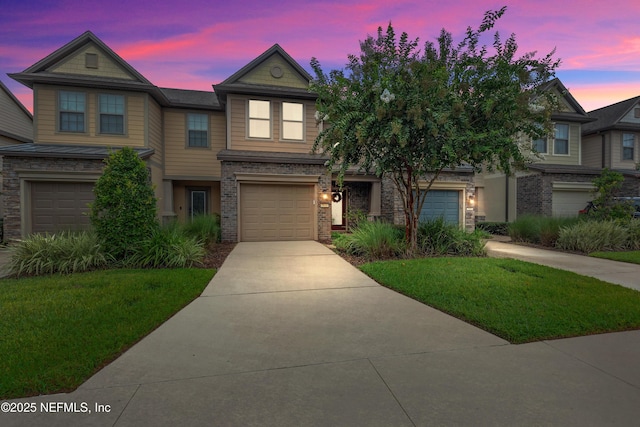 view of front of house featuring a garage, brick siding, and driveway