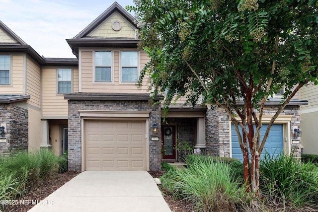 craftsman house featuring driveway, a garage, and brick siding