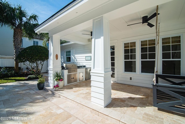 view of patio / terrace with an outdoor kitchen, area for grilling, and a ceiling fan