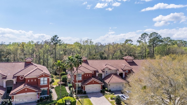 birds eye view of property with a forest view