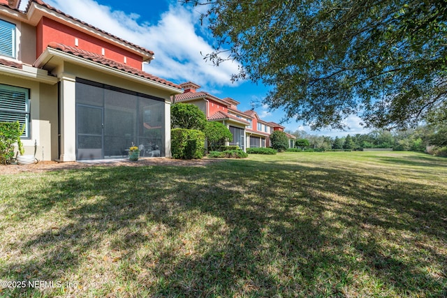 view of yard featuring a sunroom