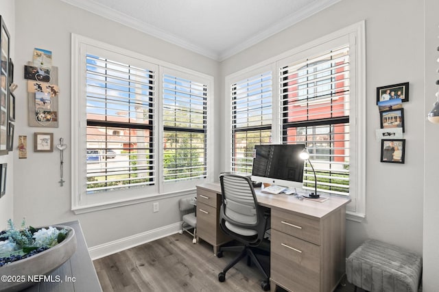 office with a healthy amount of sunlight, crown molding, baseboards, and wood finished floors