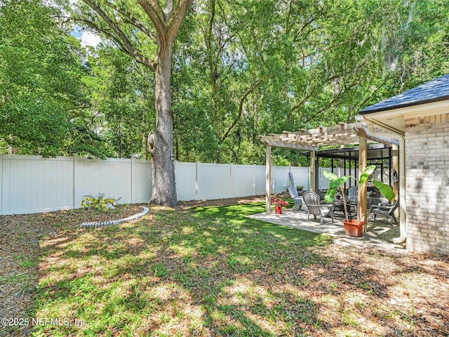 view of yard featuring a fenced backyard, a patio, and a pergola