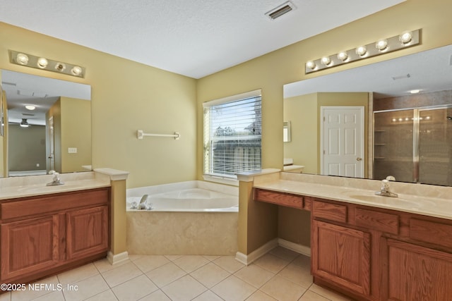 full bath with a stall shower, a sink, visible vents, and tile patterned floors