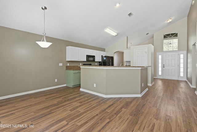 kitchen featuring dark wood-style floors, black appliances, visible vents, and white cabinetry