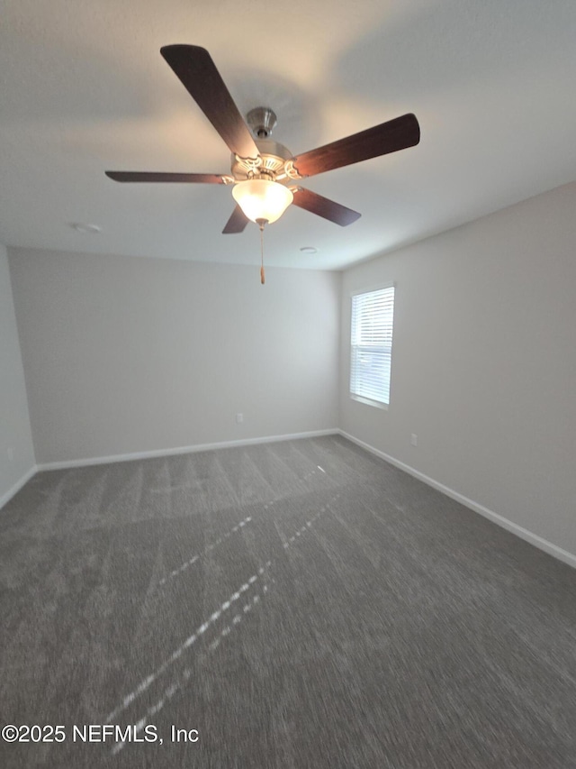 spare room with carpet floors and baseboards