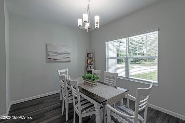 dining room with an inviting chandelier, wood finished floors, and baseboards