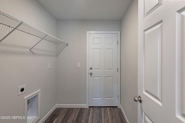 laundry area featuring laundry area, dark wood-style flooring, electric dryer hookup, and baseboards