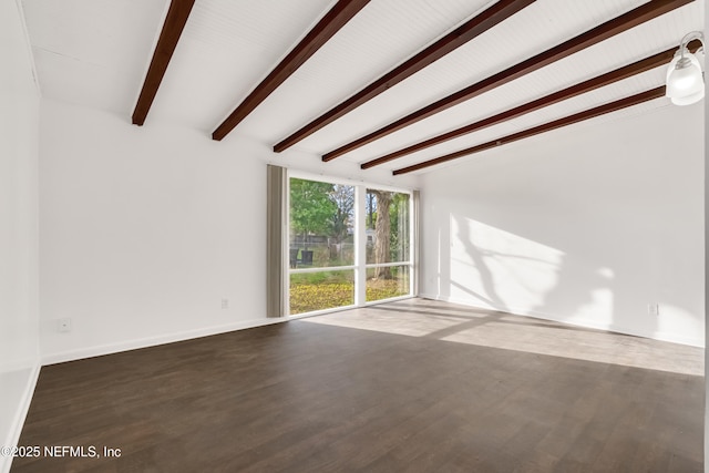 unfurnished living room featuring beam ceiling, baseboards, and wood finished floors