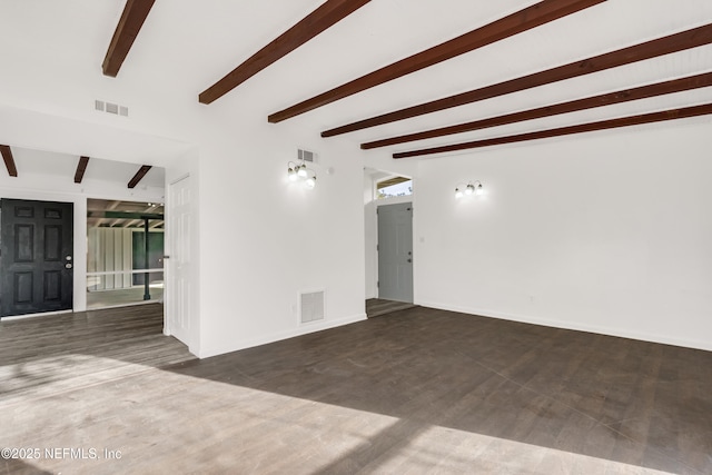 unfurnished room featuring baseboards, visible vents, and beam ceiling