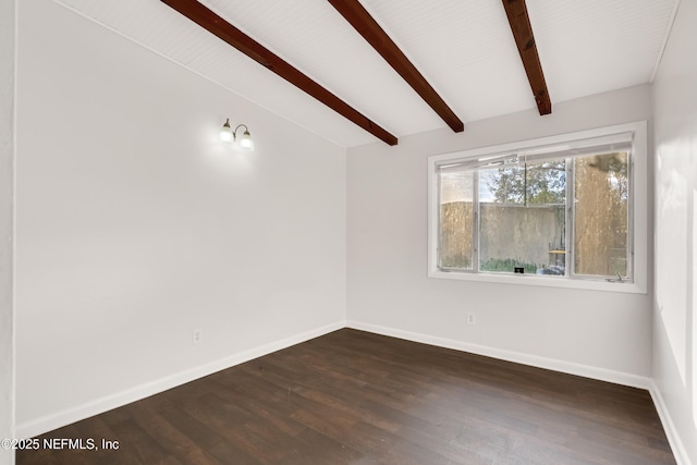 spare room with lofted ceiling with beams, dark wood-type flooring, and baseboards