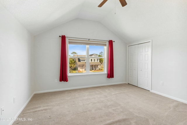 bonus room with carpet, ceiling fan, lofted ceiling, and baseboards