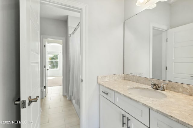 bathroom with vanity and tile patterned floors