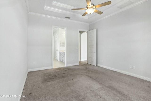 unfurnished bedroom with ornamental molding, light carpet, visible vents, and baseboards