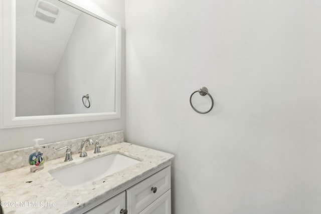 bathroom with visible vents and vanity