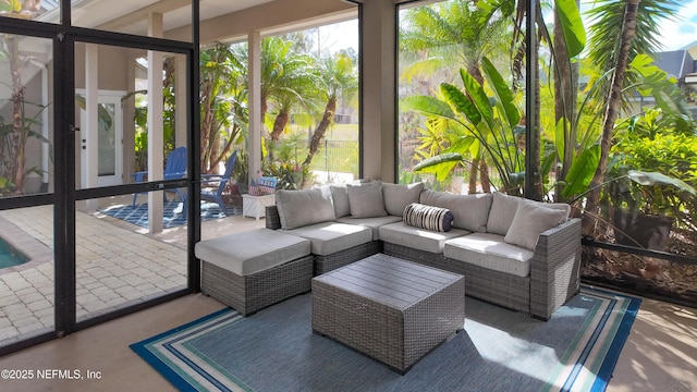 sunroom / solarium featuring a healthy amount of sunlight