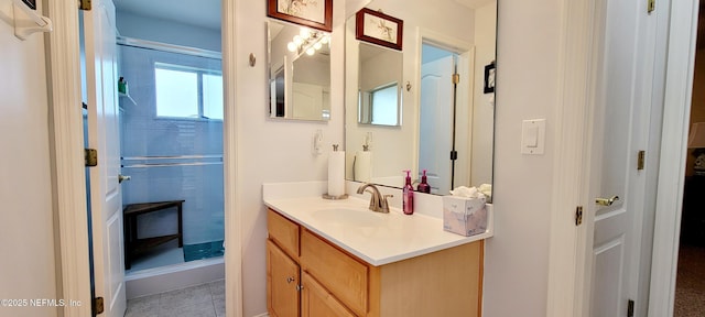 full bath featuring tile patterned floors, an enclosed shower, and vanity