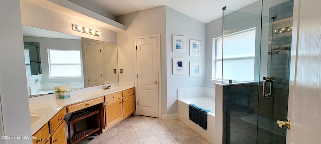 full bathroom with double vanity, a sink, a shower stall, a bath, and tile patterned floors