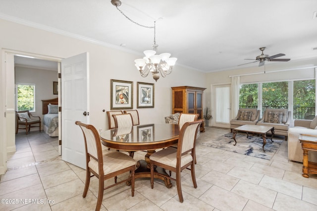 dining area with light tile patterned floors, ceiling fan with notable chandelier, and crown molding