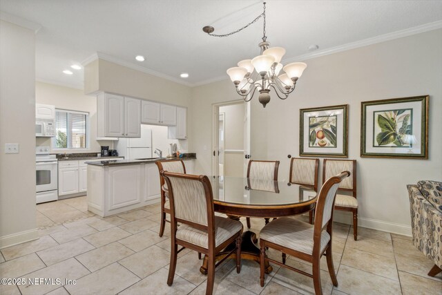 dining space with a chandelier, crown molding, baseboards, and light tile patterned floors