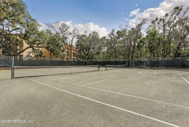 view of sport court with fence