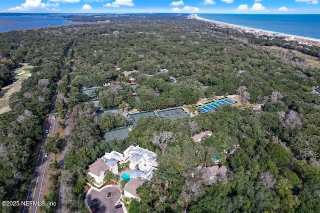 birds eye view of property featuring a water view and a view of the beach