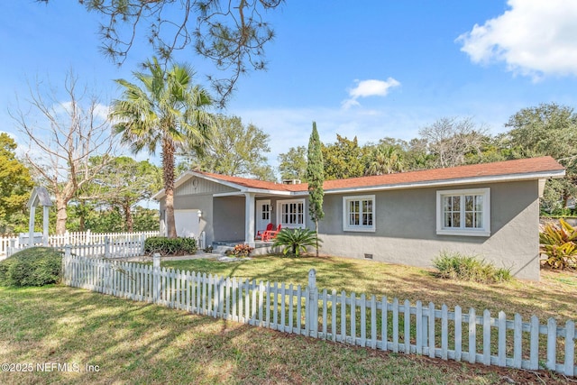 ranch-style home featuring a fenced front yard, an attached garage, crawl space, a front lawn, and stucco siding