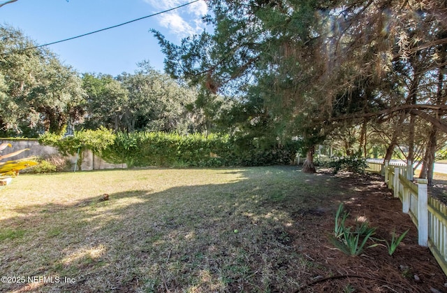 view of yard featuring fence