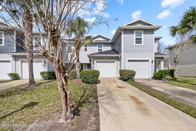 multi unit property featuring a garage