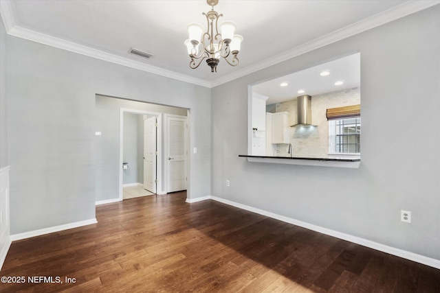 unfurnished living room with wood-type flooring, visible vents, and baseboards