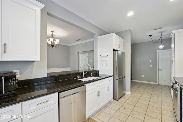 kitchen with light tile patterned floors, a sink, visible vents, white cabinetry, and appliances with stainless steel finishes