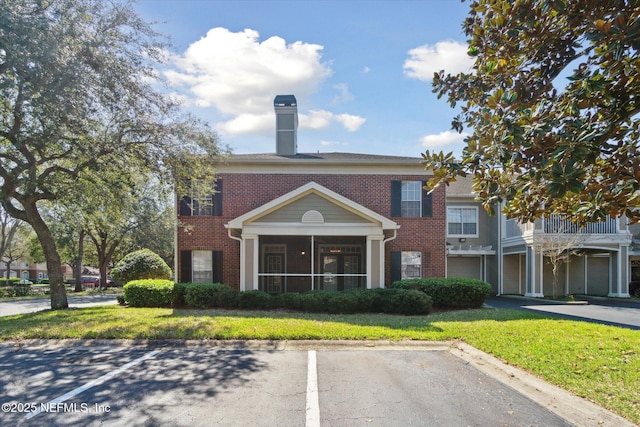 view of property with uncovered parking