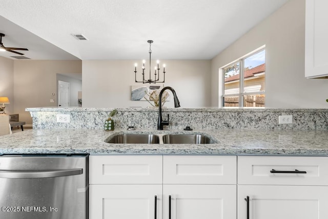 kitchen with visible vents, white cabinets, dishwasher, light stone counters, and a sink