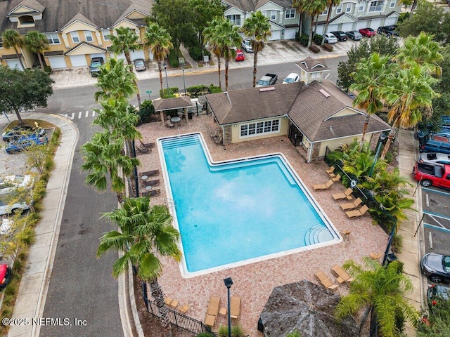 view of pool with fence and a residential view