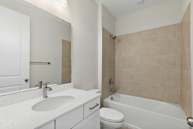 bathroom featuring vanity, shower / bathing tub combination, and toilet