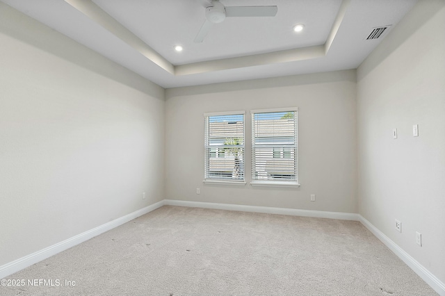 unfurnished room with visible vents, a ceiling fan, recessed lighting, baseboards, and light colored carpet