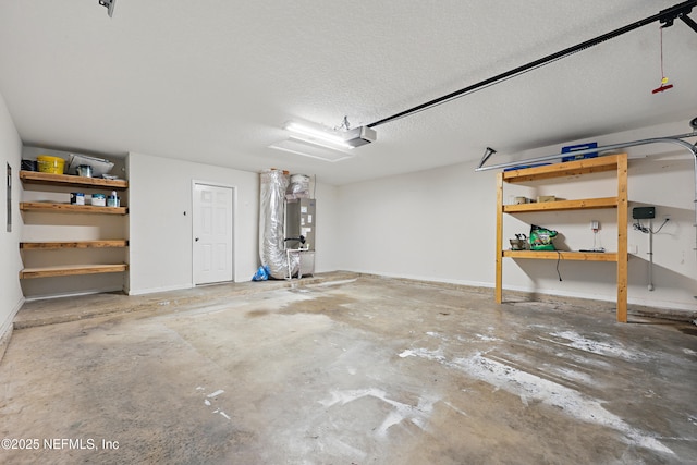 garage featuring baseboards and a garage door opener