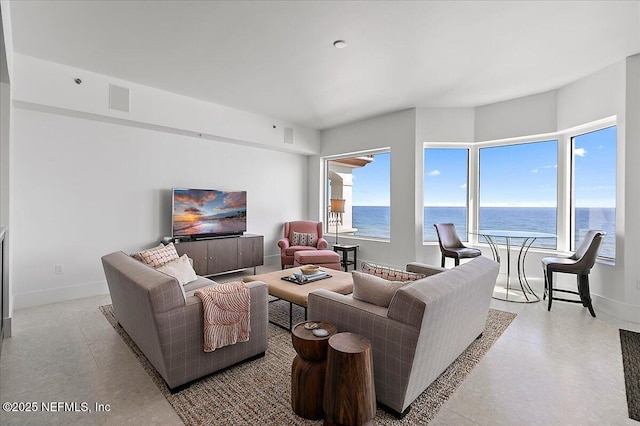 living area with visible vents and baseboards