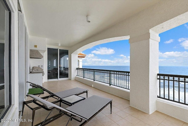 balcony featuring a water view