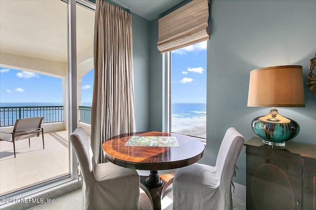 dining room featuring a water view