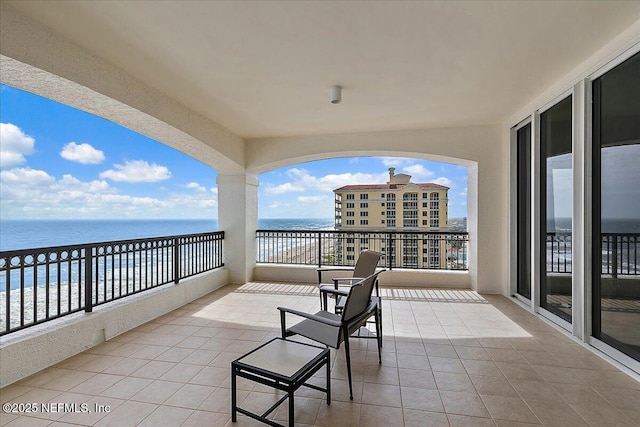 balcony featuring a water view