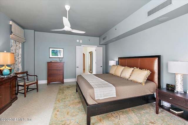 bedroom with ceiling fan, visible vents, and baseboards