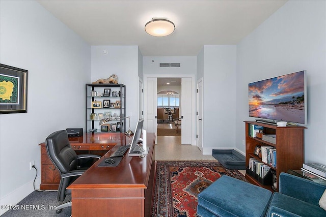 home office featuring baseboards and visible vents